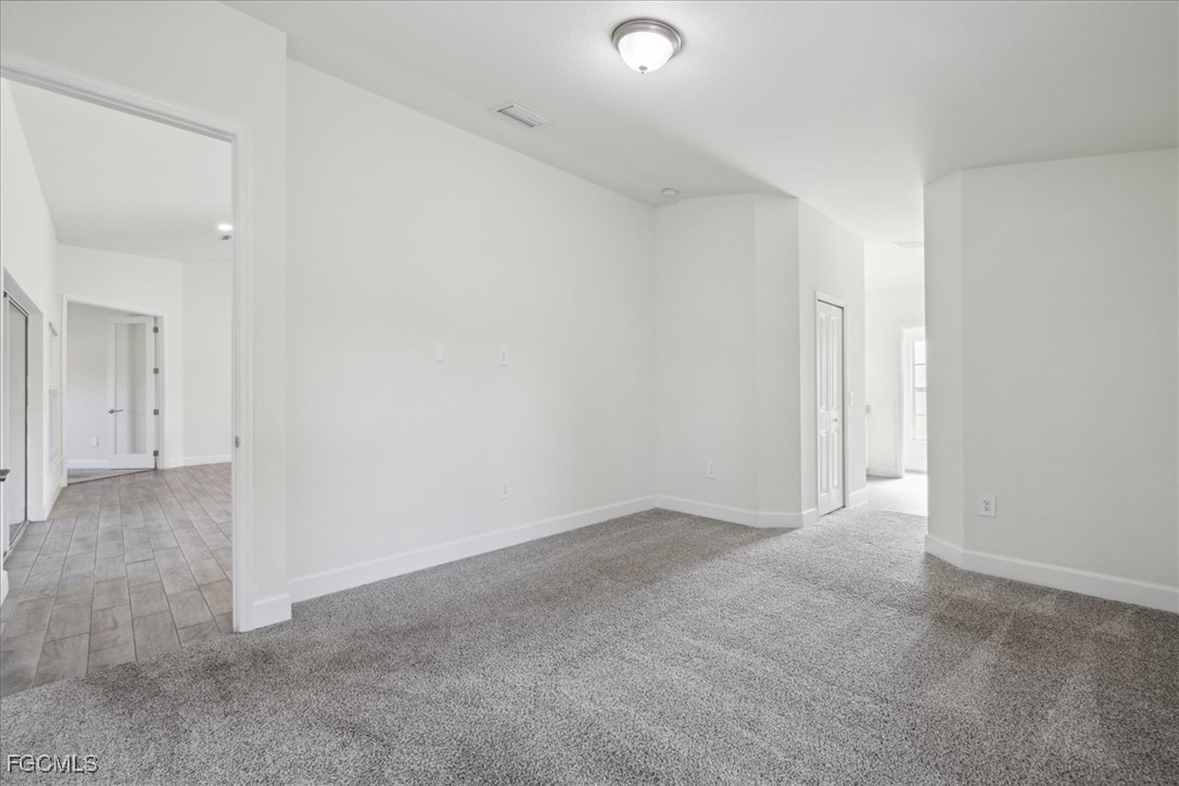 2914 Flora Avenue North Lehigh Acres, FL 33971 - Photo 15 of 39 a view of an empty room