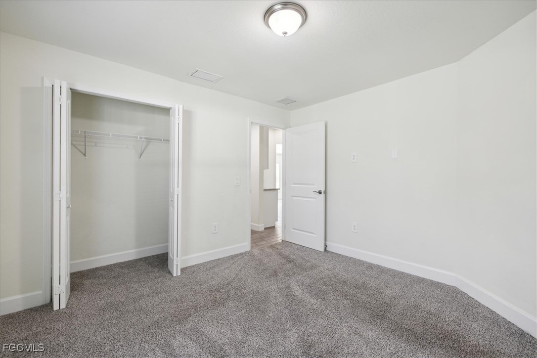 2914 Flora Avenue North Lehigh Acres, FL 33971 - Photo 24 of 39 a view of an empty room