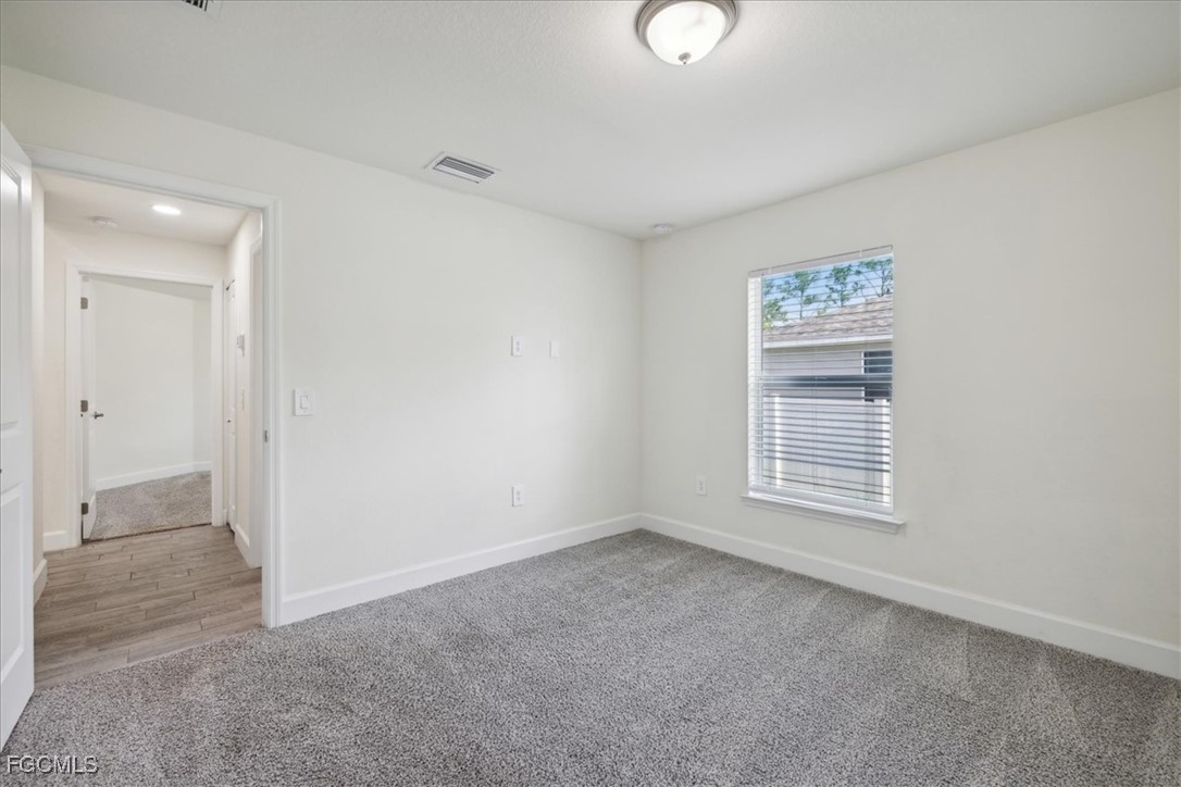 2914 Flora Avenue North Lehigh Acres, FL 33971 - Photo 27 of 39 an empty room with windows