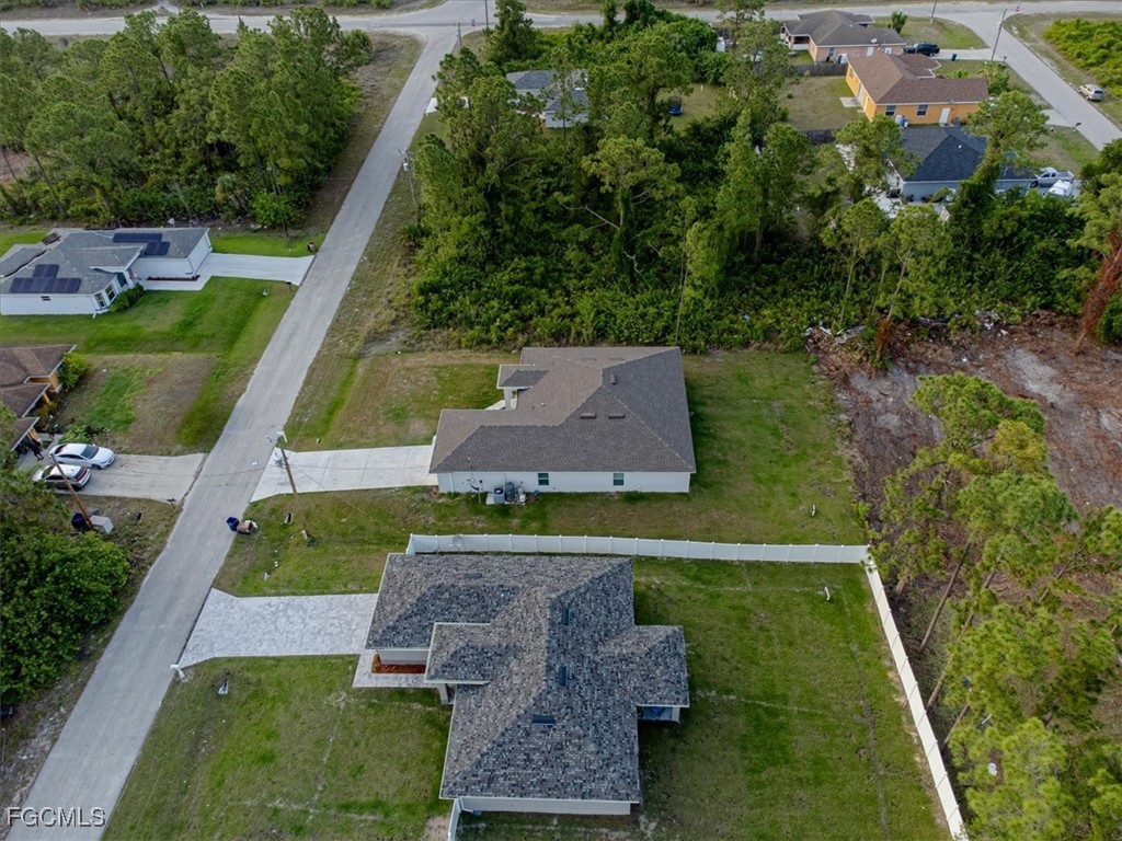 2914 Flora Avenue North Lehigh Acres, FL 33971 - Photo 37 of 39 an aerial view of house with a yard