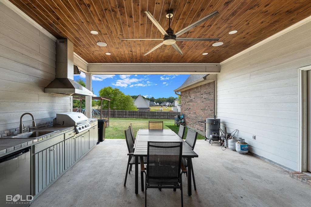 143 Oak Alley Road Stonewall, LA 71078 - Photo 35 of 38 Covered patio featuring a wood-panel ceiling, ceiling fan, and recessed lighting