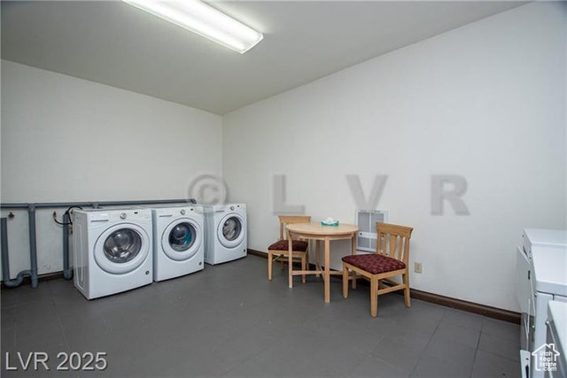 223 Hunter Ridge Drive, Unit E121 Brian Head, UT 84719 - Photo 21 of 35 Laundry area with washer and dryer and baseboards