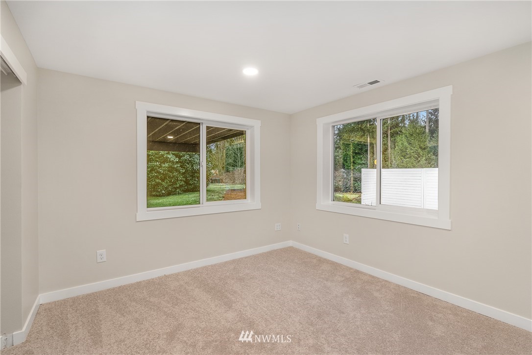 4515 169th Street Southeast Bothell, WA 98012 - Photo 22 of 34 an empty room with windows
