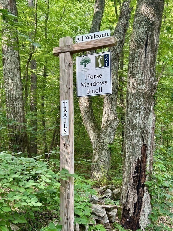 196 Swanson Road, Unit 510 Boxborough, MA 01719 - Photo 18 of 20 a sign on the side of a tree
