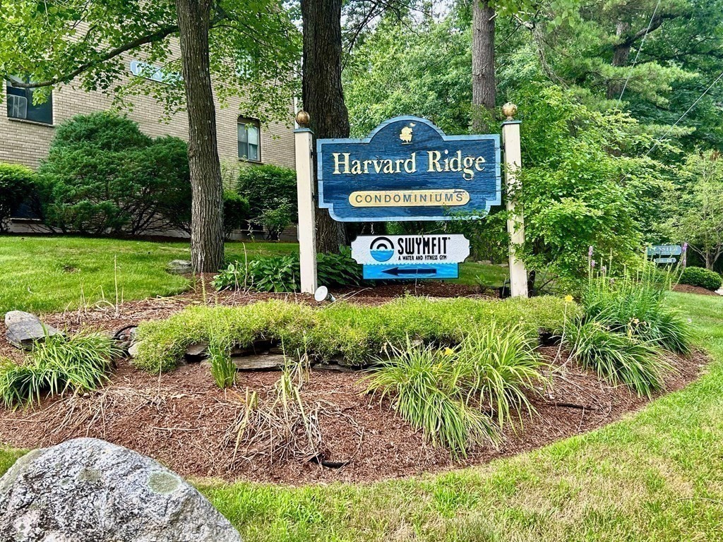 196 Swanson Road, Unit 510 Boxborough, MA 01719 - Photo 20 of 20 a view of a street sign under a large tree