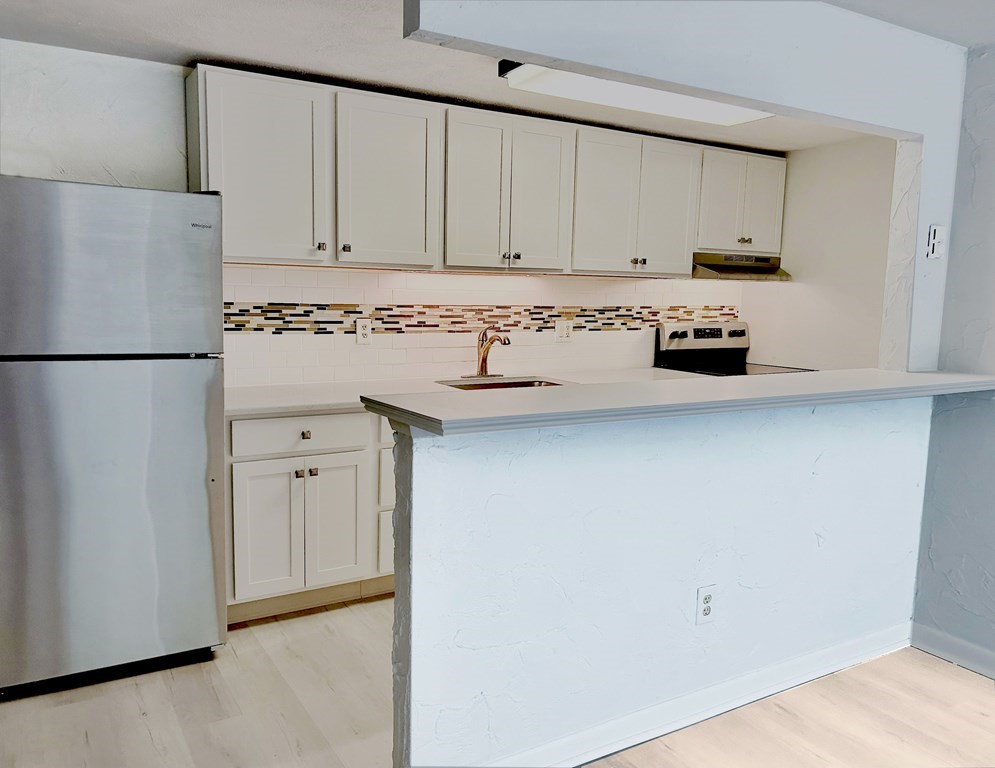 196 Swanson Road, Unit 510 Boxborough, MA 01719 - Photo 2 of 20 a white refrigerator freezer sitting in a kitchen