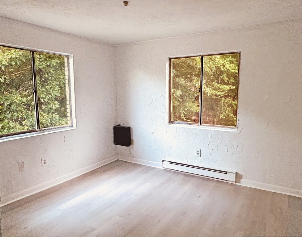 196 Swanson Road, Unit 510 Boxborough, MA 01719 - Photo 5 of 20 an empty room with a window