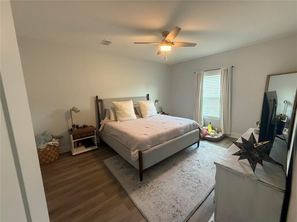 105 Pentecost Way Fort Walton Beach, FL 32547 - Photo 14 of 17 a bedroom with a bed window and a flat screen tv