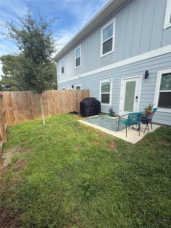105 Pentecost Way Fort Walton Beach, FL 32547 - Photo 2 of 17 a backyard of a house with table and chairs