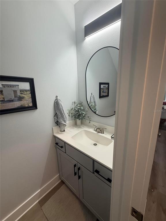 105 Pentecost Way Fort Walton Beach, FL 32547 - Photo 8 of 17 a bathroom with a sink and a mirror