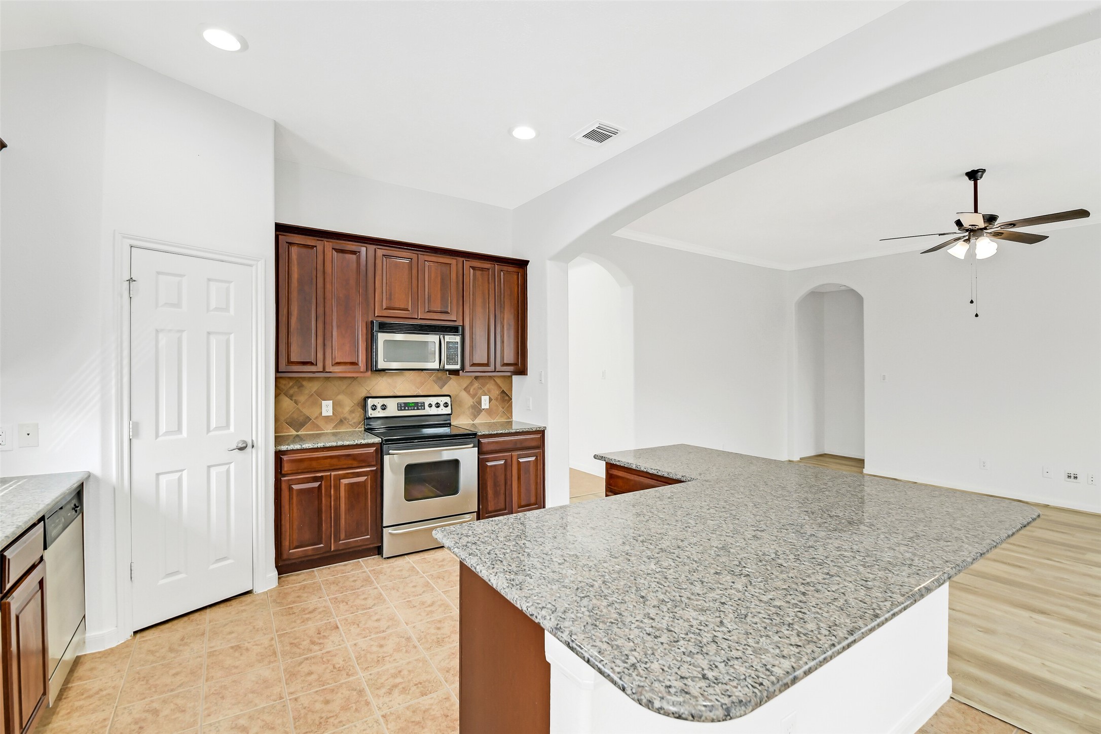 19227 Countryhills Court Spring, TX 77388 - Photo 15 of 33 Kitchen featuring elegant granite countertops and a stylish breakfast bar.