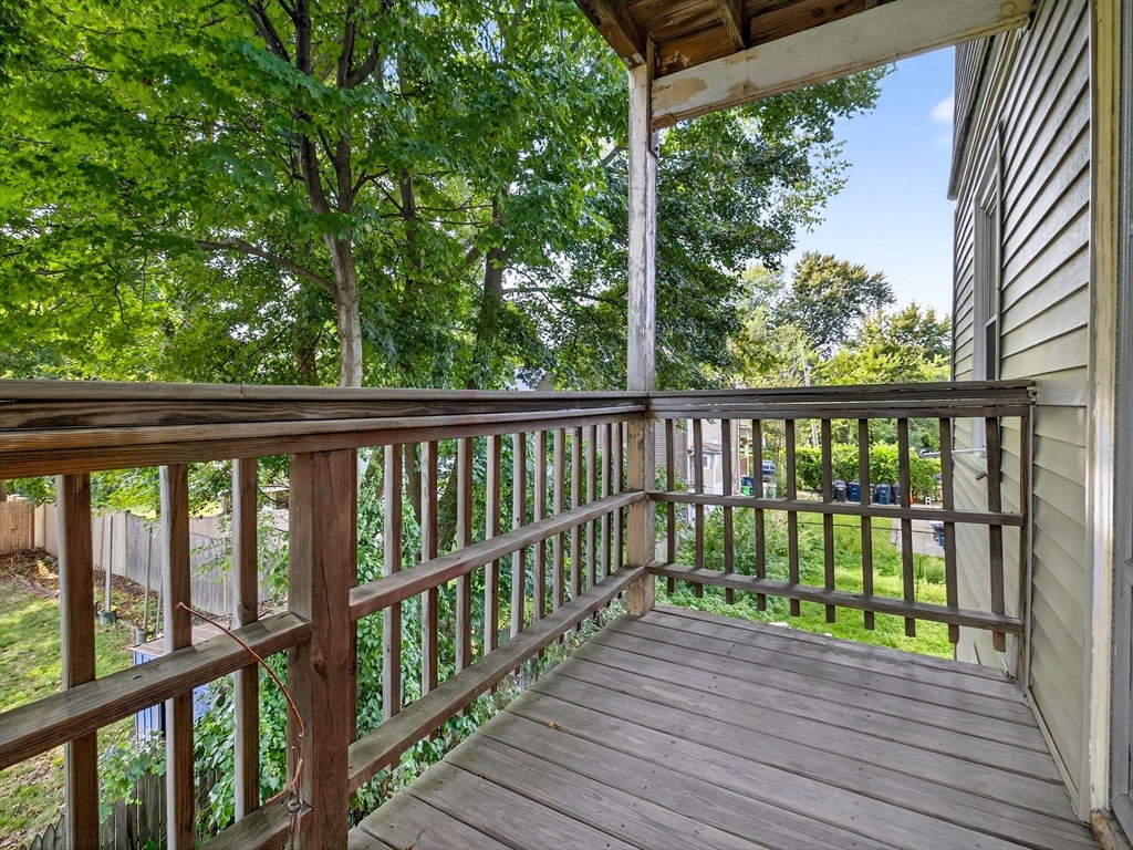 187 Florence Street, Unit 2L Boston, MA 02131 - Photo 11 of 15 a view of a porch with a yard