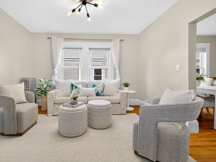 a living room with furniture and windows