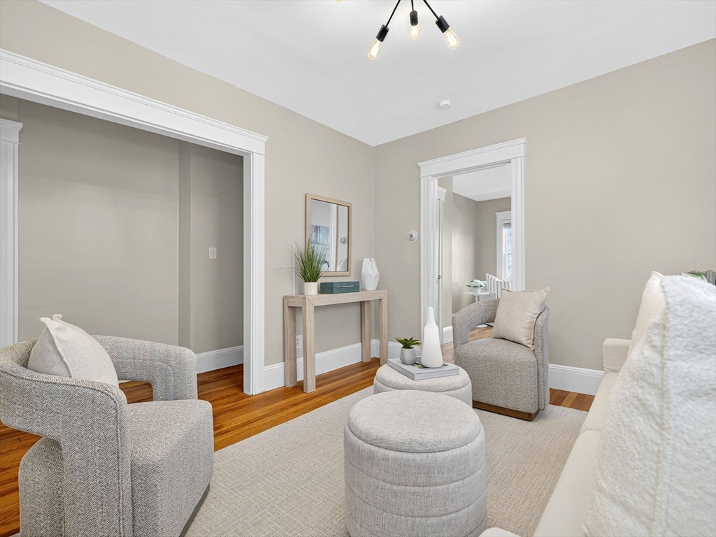 187 Florence Street, Unit 2L Boston, MA 02131 - Photo 4 of 15 a living room with furniture and a table