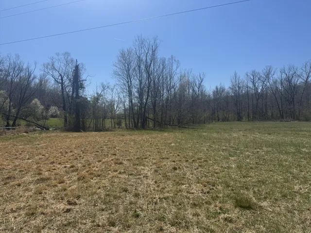 a room with furniture a flat screen tv and a window