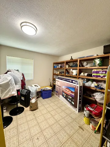 an aerial view of a houses with a yard