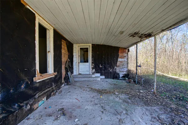 a view of room with window and furniture