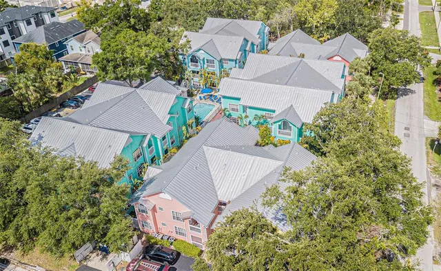 an aerial view of a house with a garden