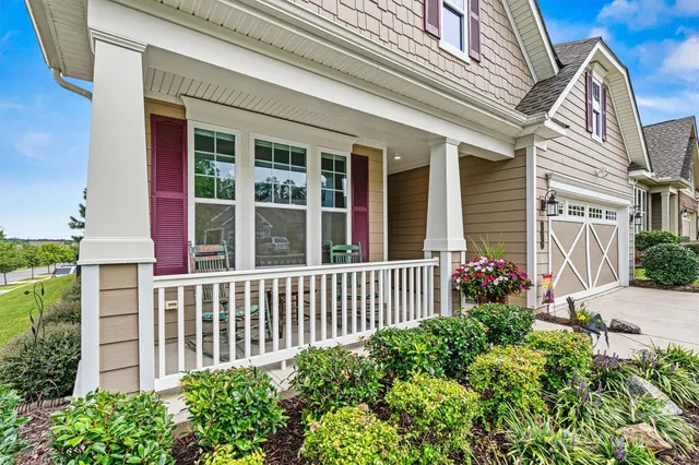 a view of a house with a flower garden