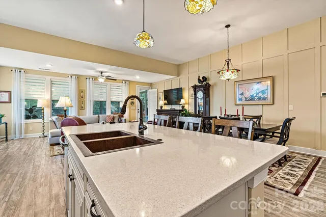 a bathroom with a sink a mirror a vanity and shower