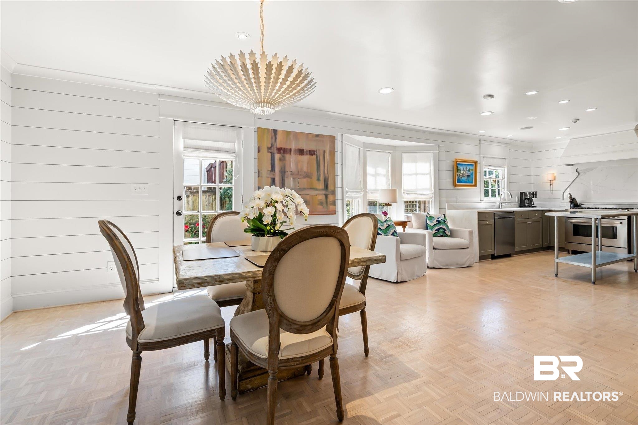 3921 McGregor Court Mobile, AL 36608 - Photo 6 of 41 Dining space with recessed lighting, a chandelier, crown molding, and wood walls