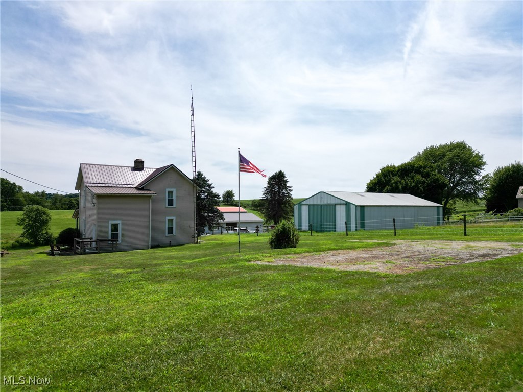 6596 Mill Road Northwest Dundee, OH 44624 - Photo 3 of 18 View of yard with an outbuilding and an outdoor structure