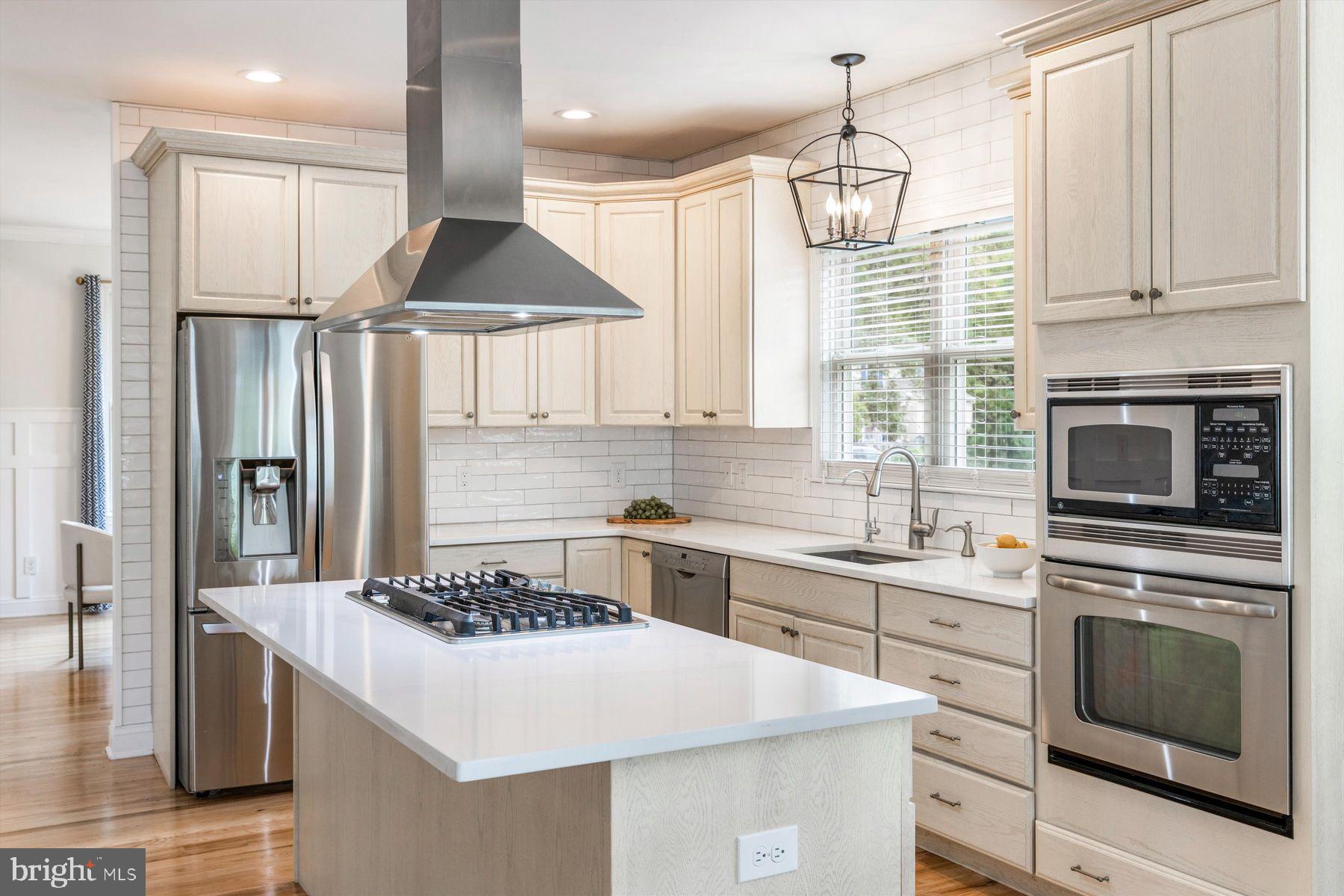 30 Reading Avenue Yardley, PA 19067 - Photo 13 of 39 a kitchen with a stove a sink and a refrigerator