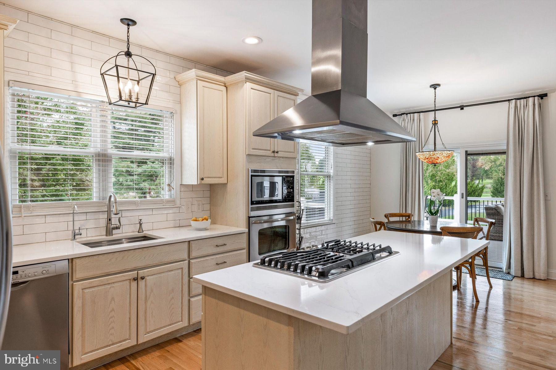 30 Reading Avenue Yardley, PA 19067 - Photo 15 of 39 a kitchen with a stove a sink a window and chairs