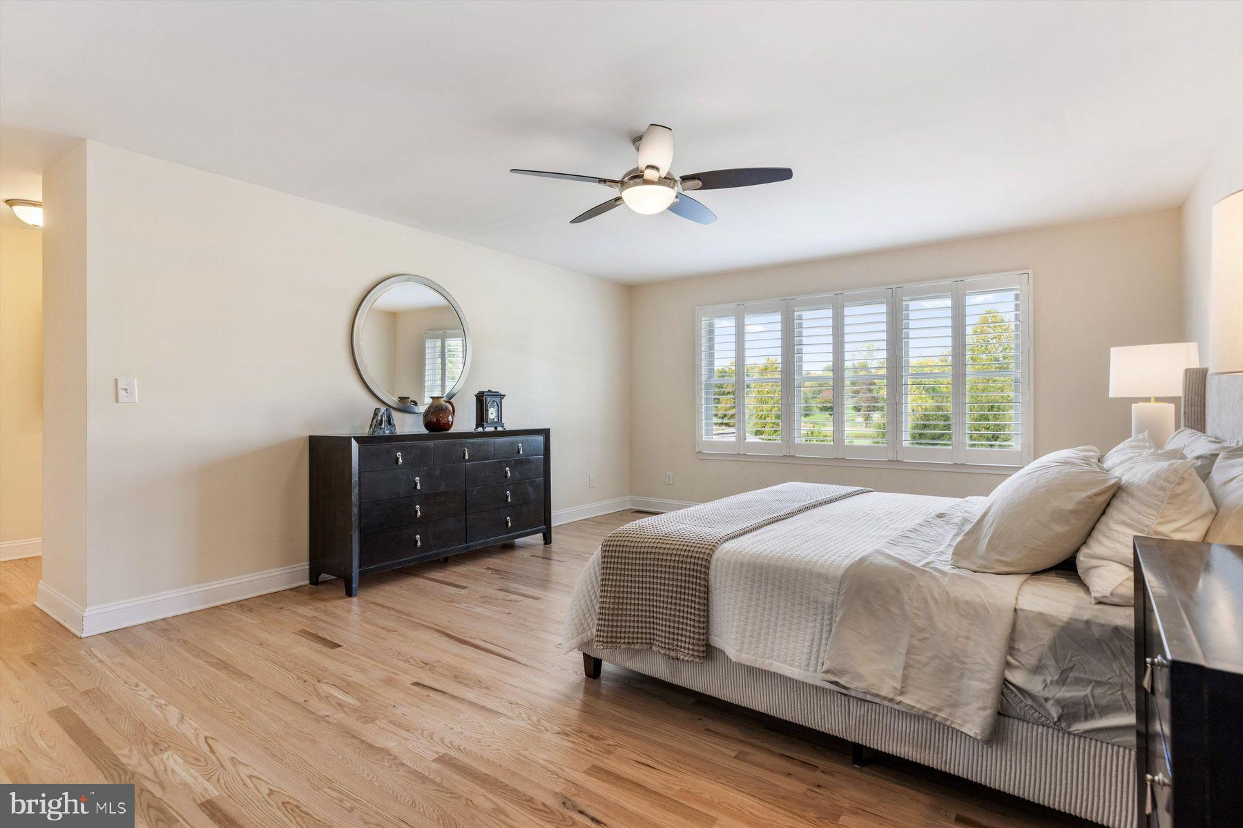 30 Reading Avenue Yardley, PA 19067 - Photo 26 of 39 a bedroom with a bed and a chandelier