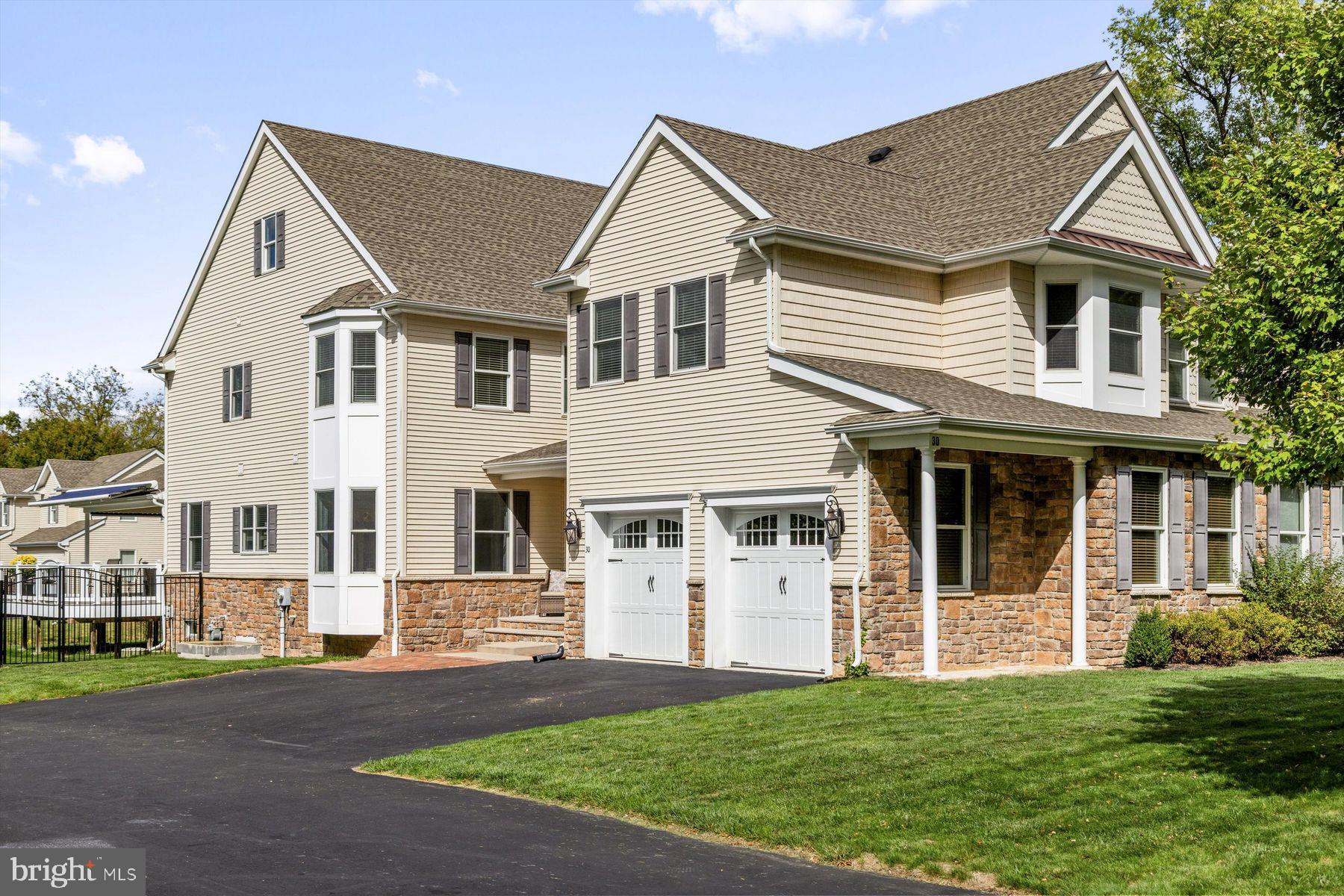 30 Reading Avenue Yardley, PA 19067 - Photo 3 of 39 a view of a white house with a big yard and large trees