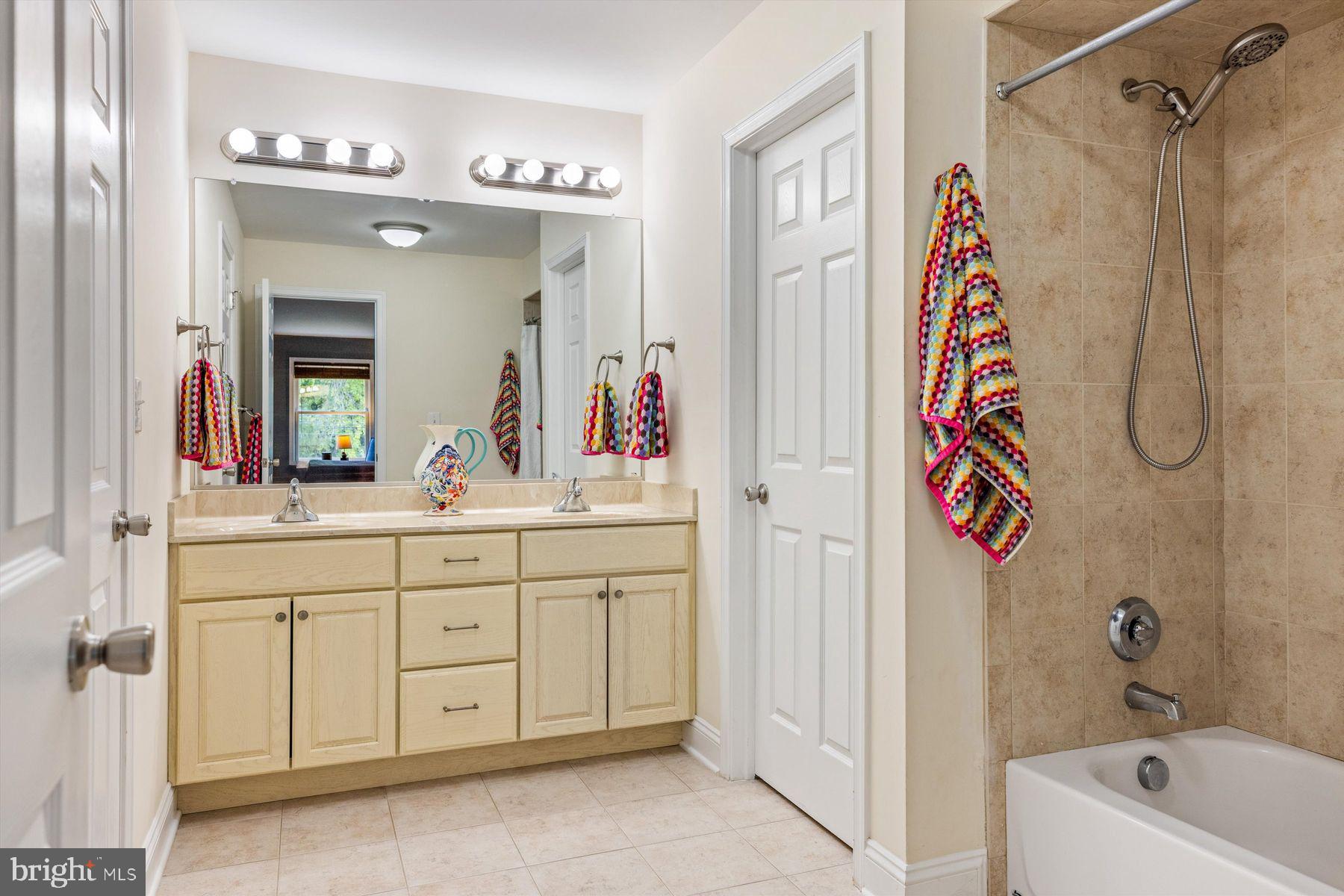 30 Reading Avenue Yardley, PA 19067 - Photo 36 of 39 a bathroom with a sink a mirror a vanity and a shower