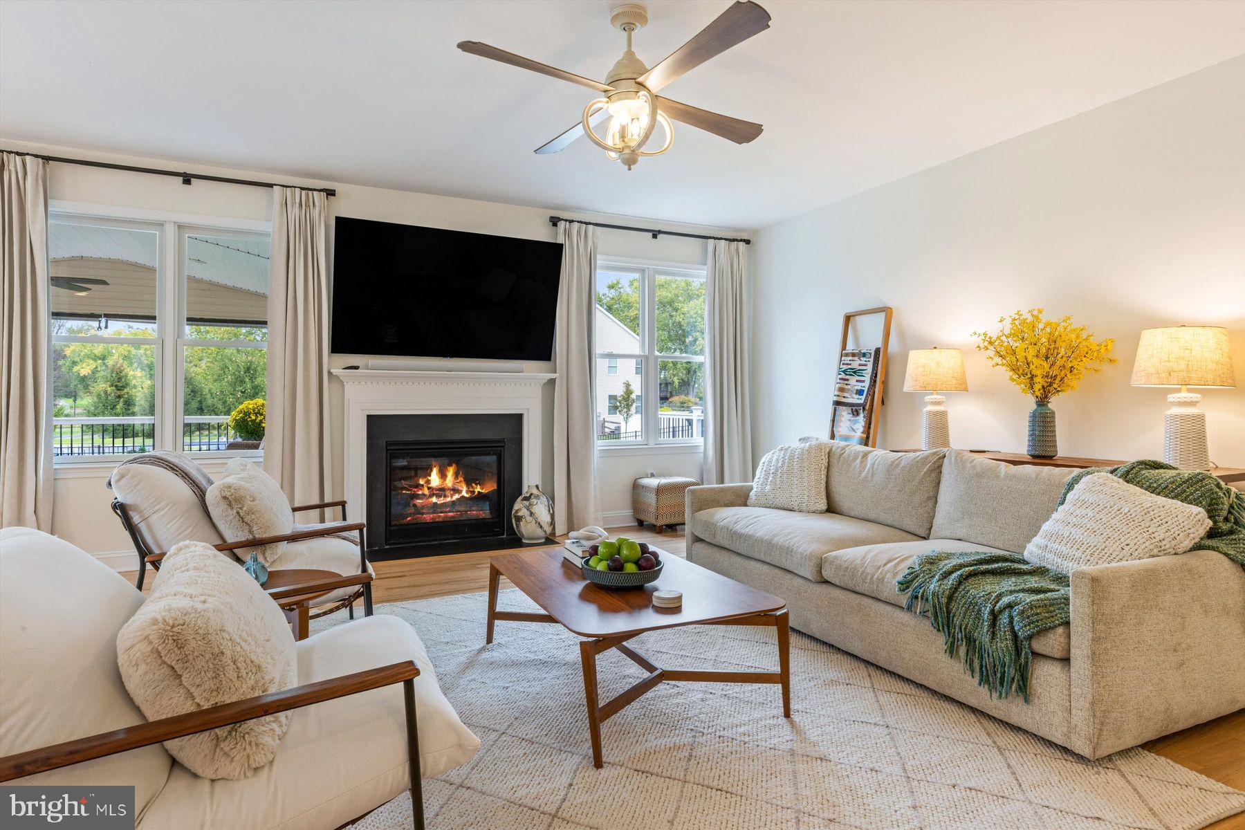 30 Reading Avenue Yardley, PA 19067 - Photo 10 of 39 a living room with furniture a flat screen tv and a fireplace