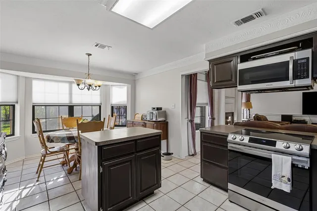 a kitchen with a stove and a microwave