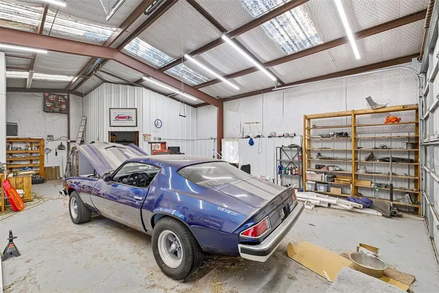 a view of parking garage with cars parked