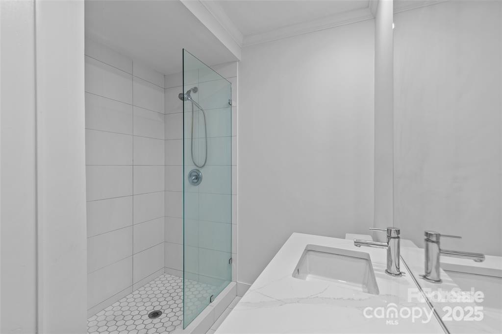 609 Queens Road, Unit A Charlotte, NC 28207 - Photo 21 of 34 a bathroom with a bathtub and shower
