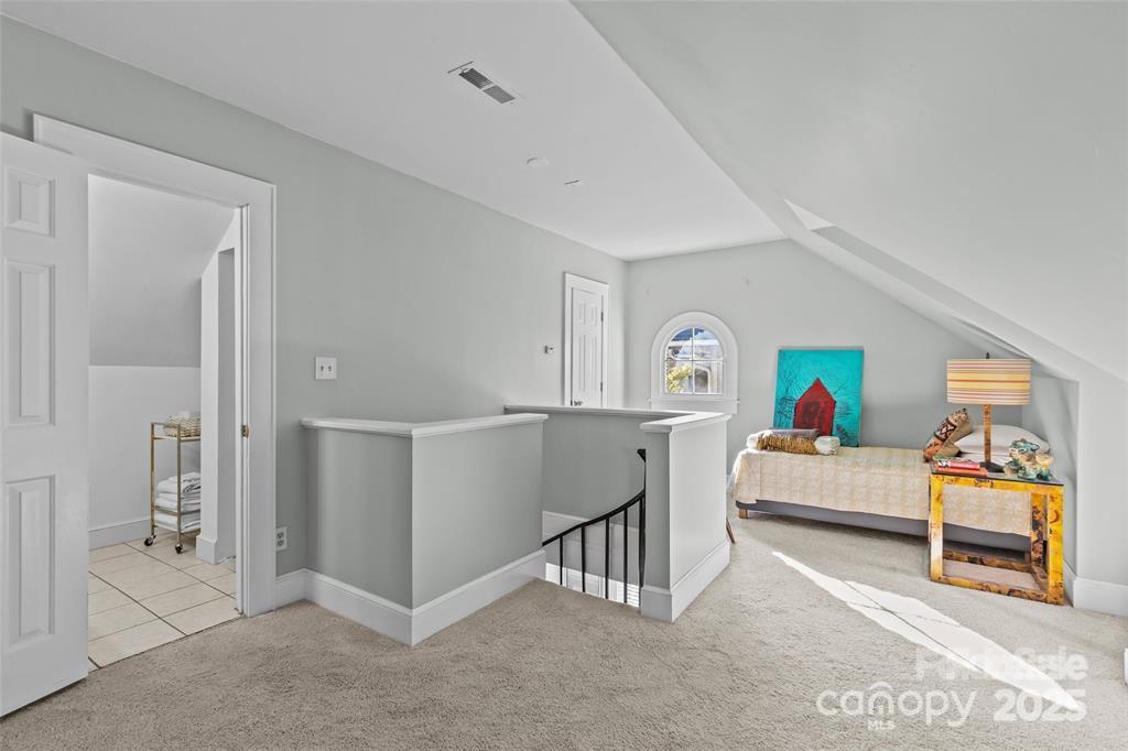 609 Queens Road, Unit A Charlotte, NC 28207 - Photo 28 of 34 a living room with furniture and a table