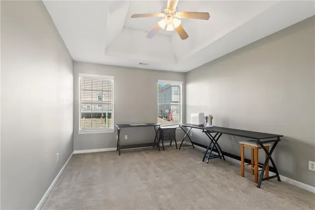 a view of a livingroom with furniture and a window