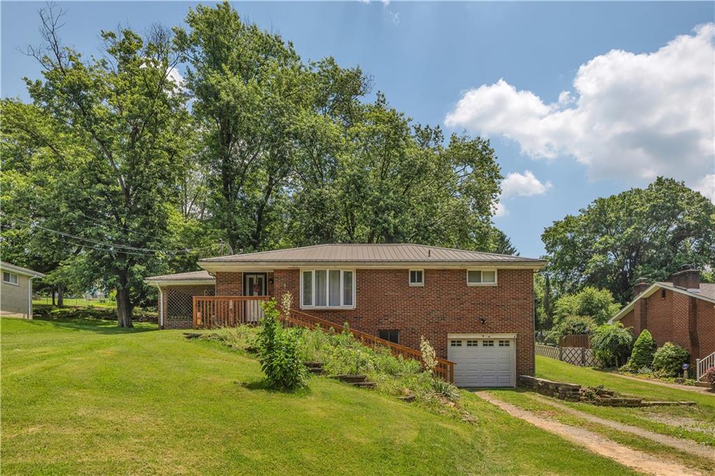 a aerial view of a house with swimming pool and garden