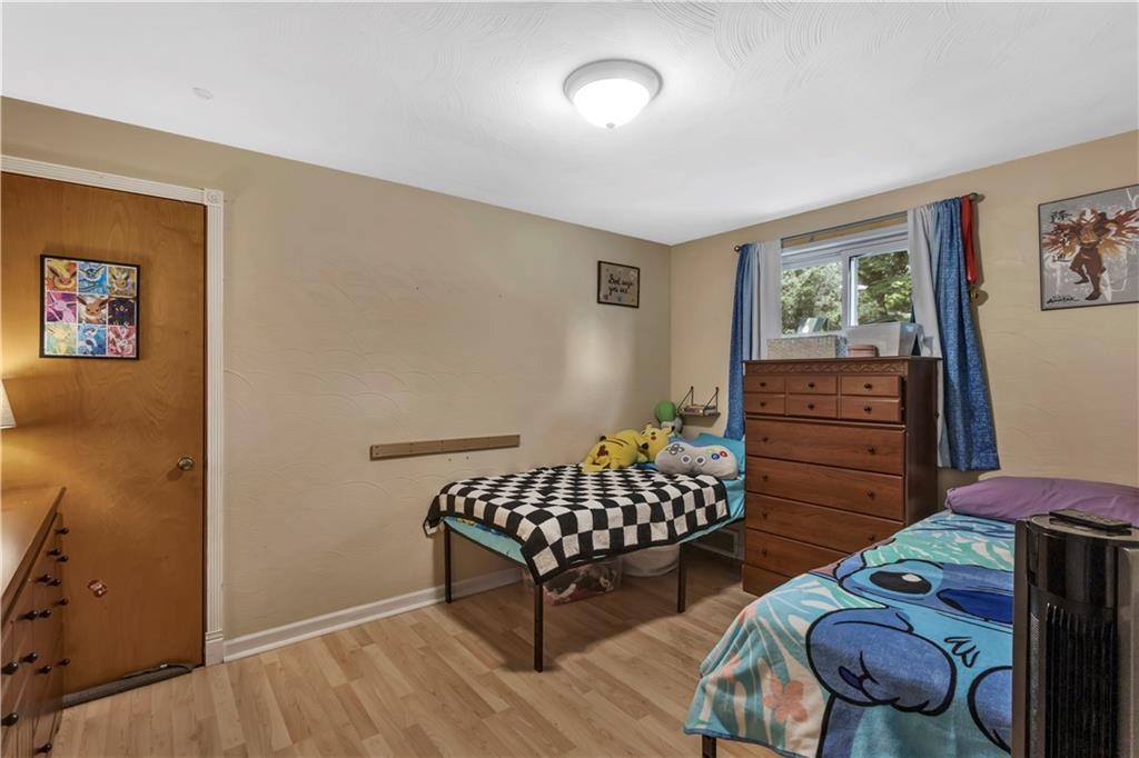 391 Wendel Road Irwin, PA 15642 - Photo 16 of 32 a living room with furniture and a window