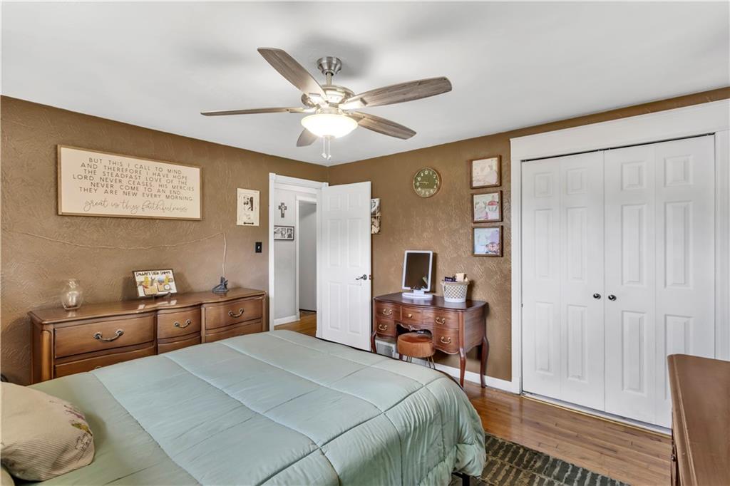 391 Wendel Road Irwin, PA 15642 - Photo 19 of 32 a bedroom with a bed and a chandelier