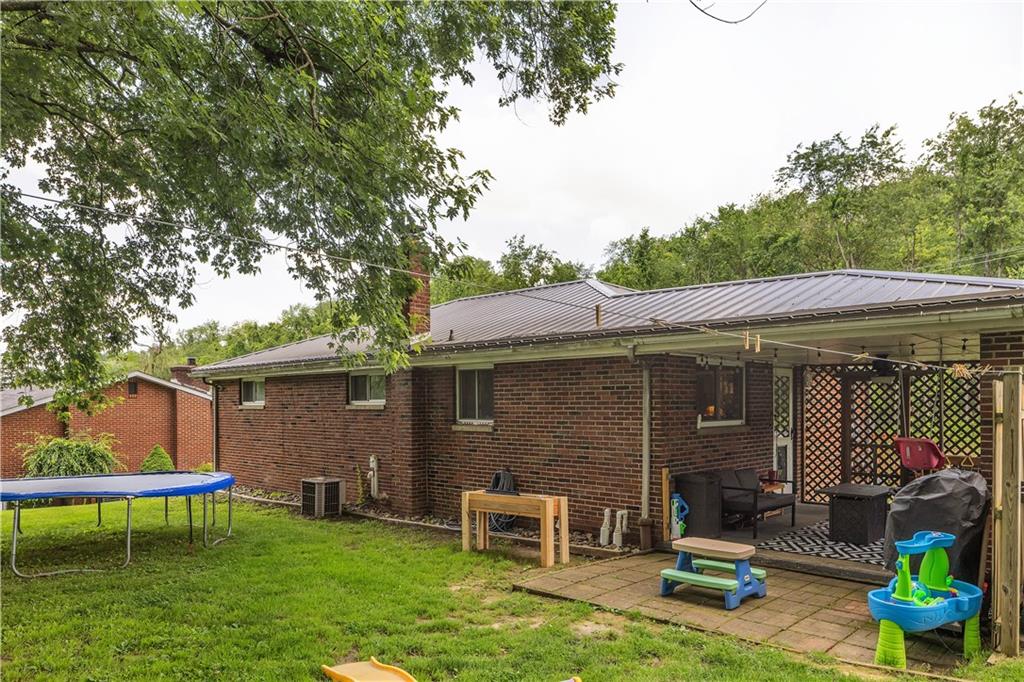 391 Wendel Road Irwin, PA 15642 - Photo 27 of 32 a front view of a house with a garden