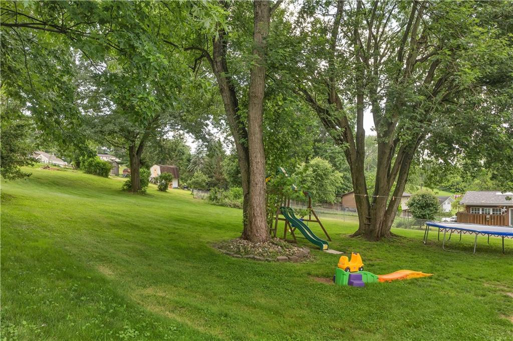 391 Wendel Road Irwin, PA 15642 - Photo 28 of 32 a view of a backyard with large trees and plants