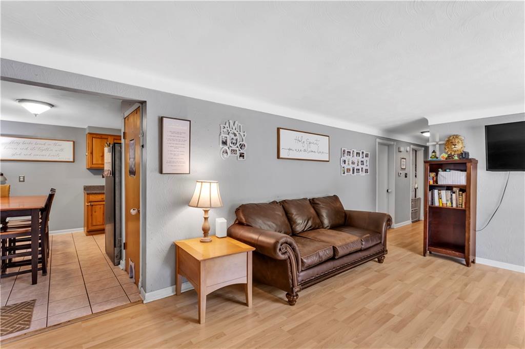 391 Wendel Road Irwin, PA 15642 - Photo 4 of 32 a living room with furniture and a flat screen tv