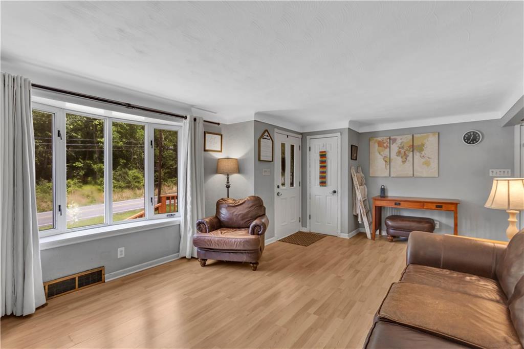 391 Wendel Road Irwin, PA 15642 - Photo 8 of 32 a living room with furniture and a window