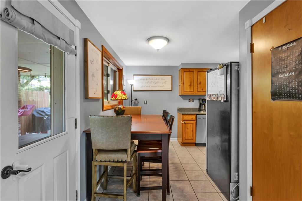 391 Wendel Road Irwin, PA 15642 - Photo 9 of 32 a dining room with furniture and window