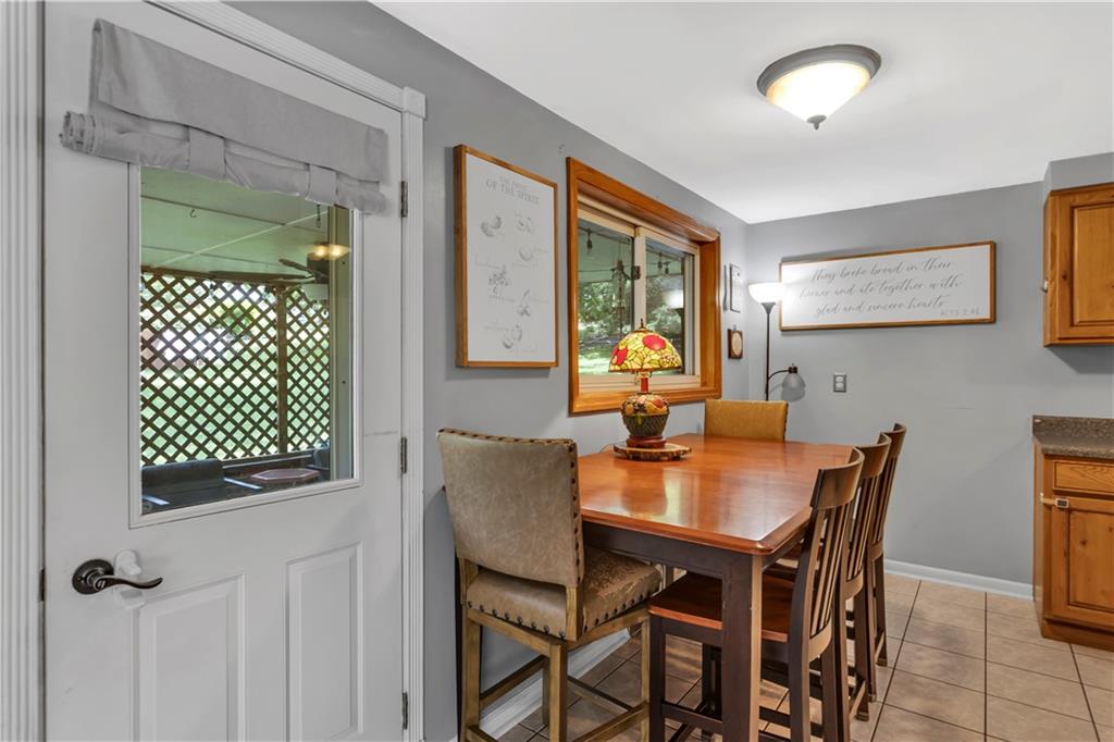 391 Wendel Road Irwin, PA 15642 - Photo 10 of 32 a view of a dining room with furniture and a potted plant