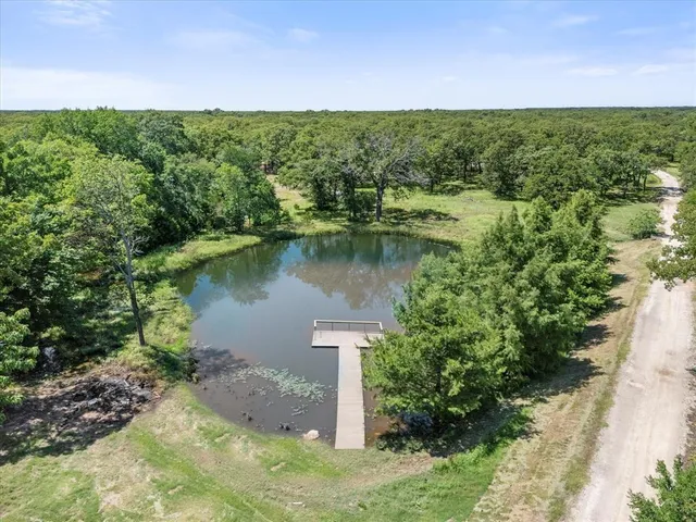 a view of a lake with a building in the background