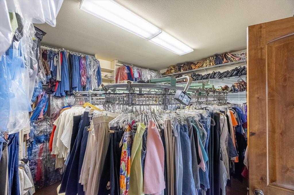 2702 Hidden Trails Road Royse City, TX 75189 - Photo 20 of 39 a view of walk in closet with clothes
