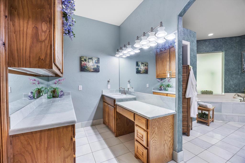 2702 Hidden Trails Road Royse City, TX 75189 - Photo 24 of 39 a kitchen with a sink and cabinets