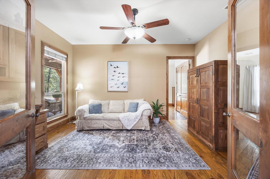 2702 Hidden Trails Road Royse City, TX 75189 - Photo 28 of 39 a living room with furniture and a large window